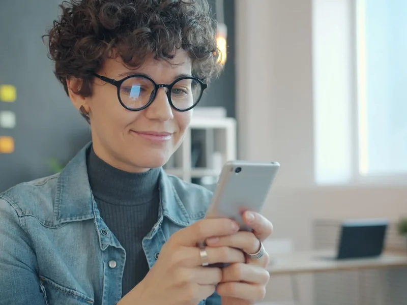 Care manager on a video call with an artist on a laptop screen