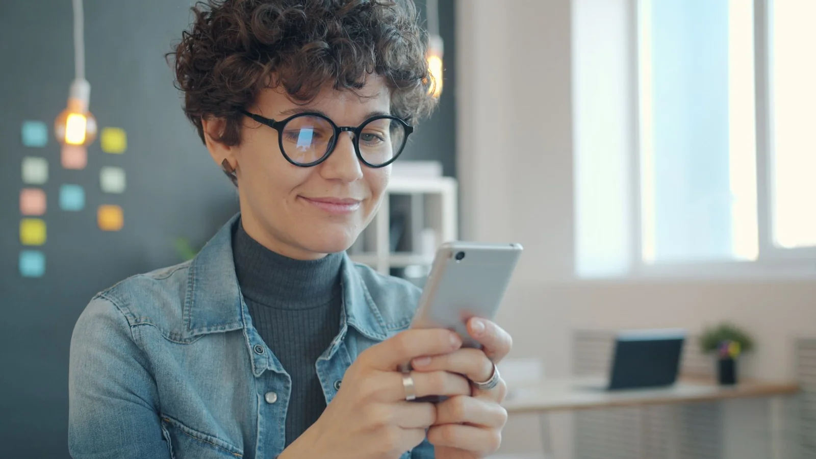Care manager on a video call with an artist on a laptop screen