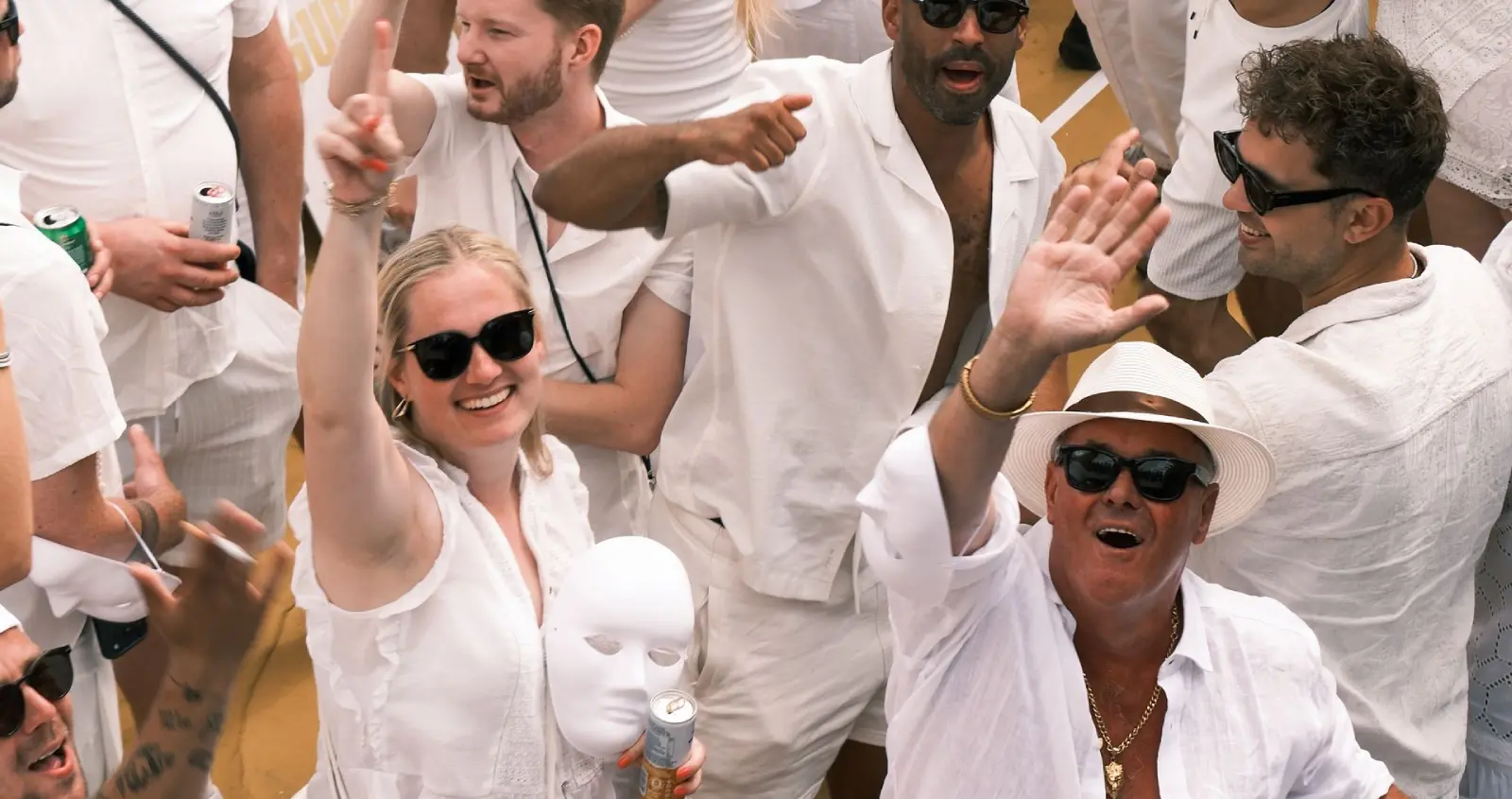 Guests in white celebrating at a themed deck party