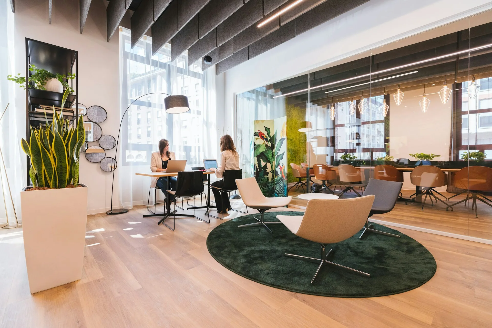 Modern business centre office with glass meeting room and collaborative workspace
